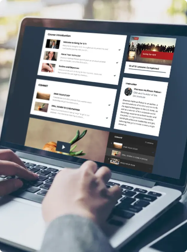 Hands on a laptop showing a Grit Institute online course