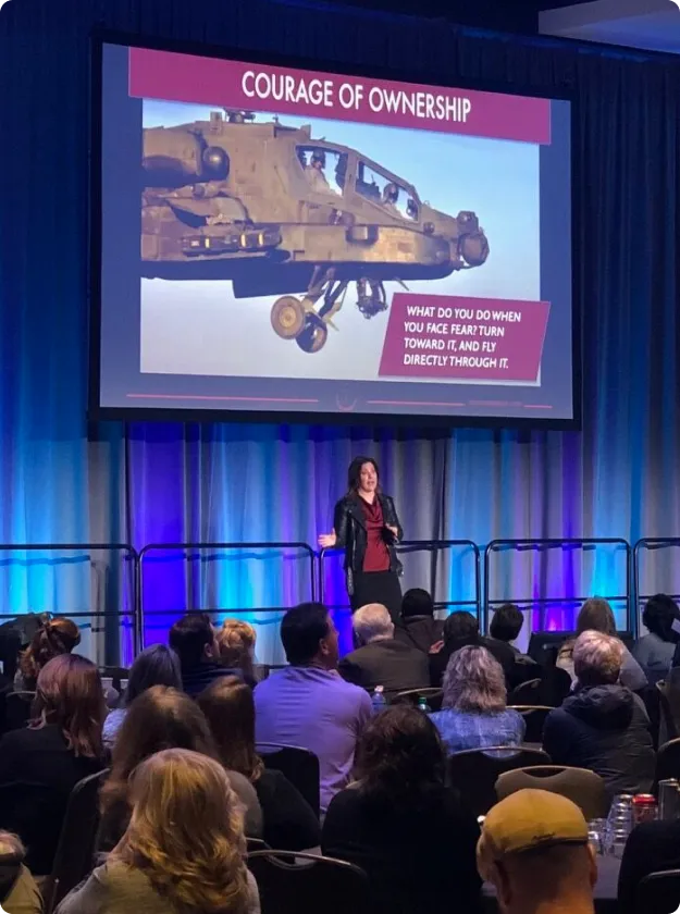 Shannon Huffman Polson speaking beneath a slide titled Courage of Ownership