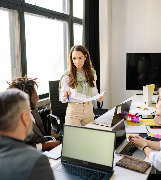 Woman leading a team discussion in a modern office
