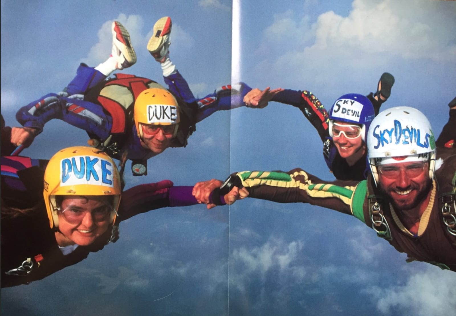 Duke skydiving team members in freefall