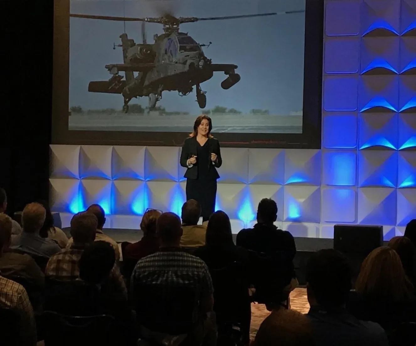 Shannon Huffman Polson speaking to a ballroom audience